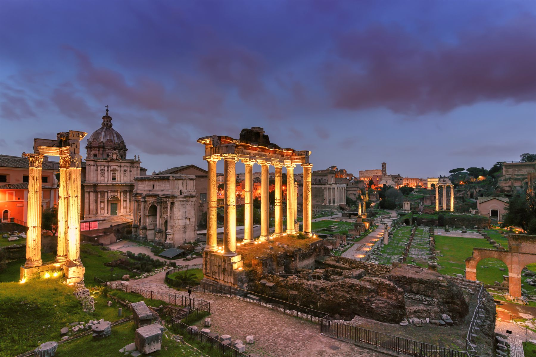 The Roman Forum floodlit at night in Rome, Italy